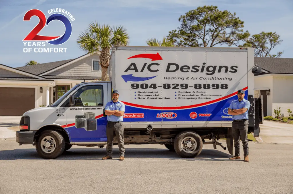 employees in front of an ac designs truck