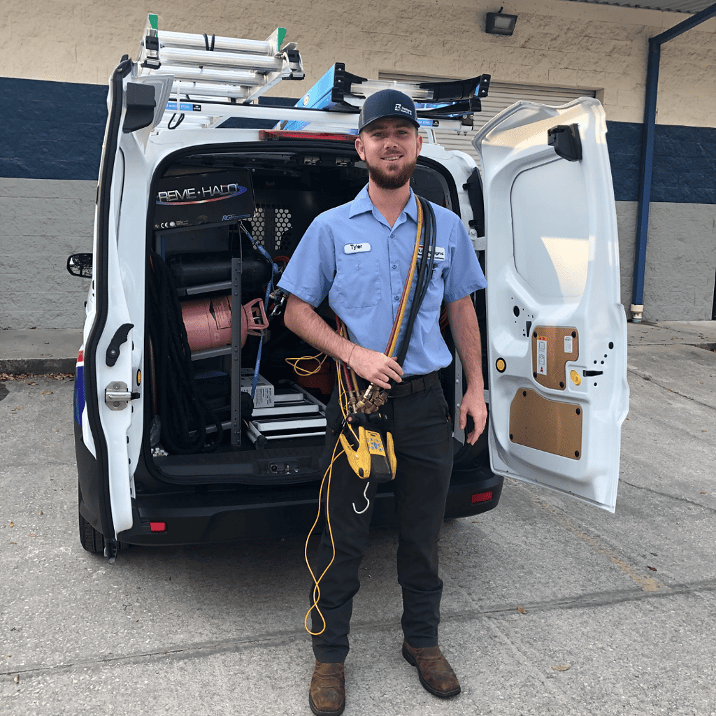 Tyler in front of an AC Designs van